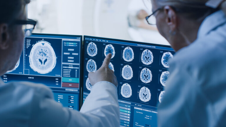 Radiologists visually analyze MRI and PET readings of a brain